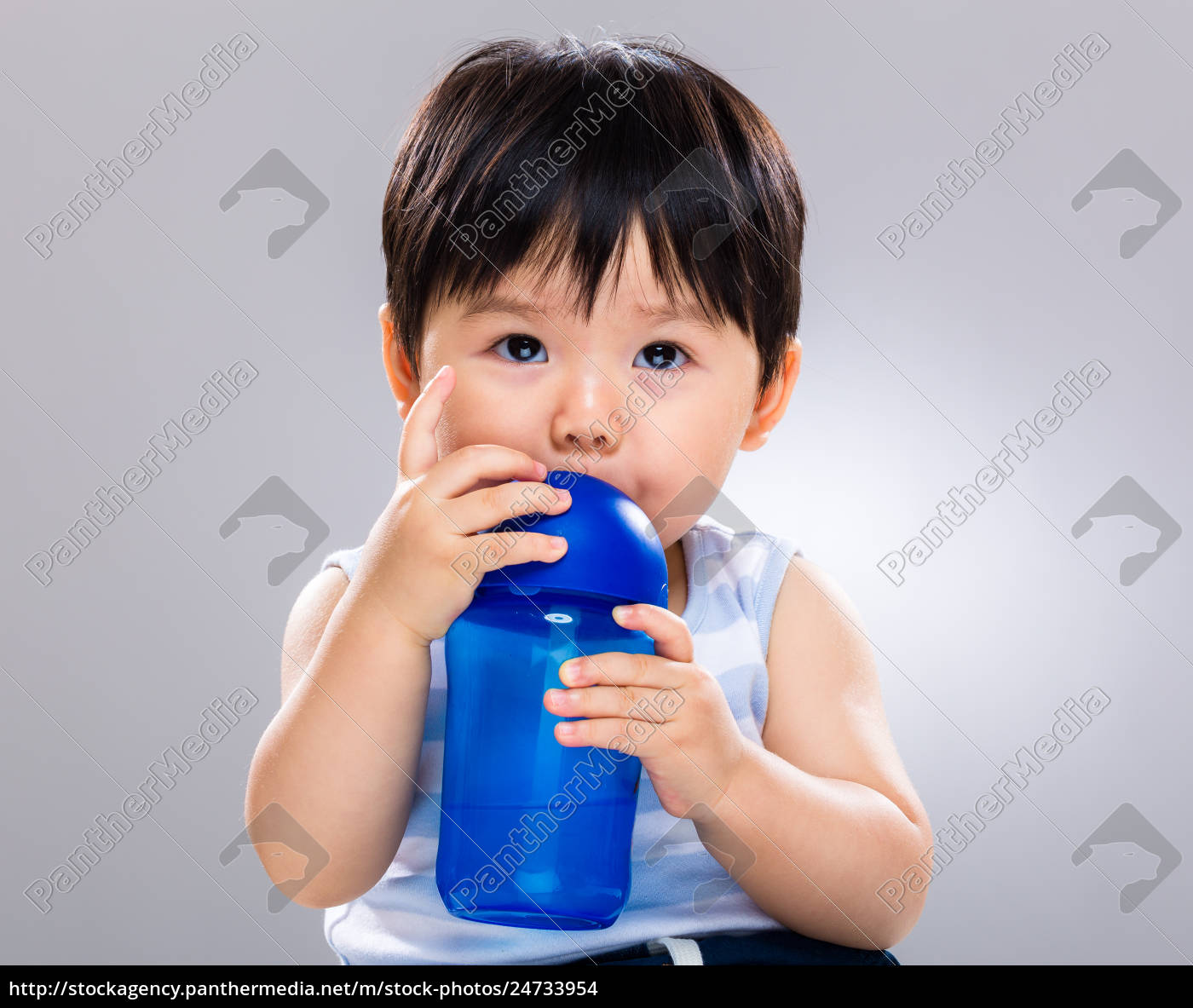 Baby boy drinking with water bottle - Stock image #24733954